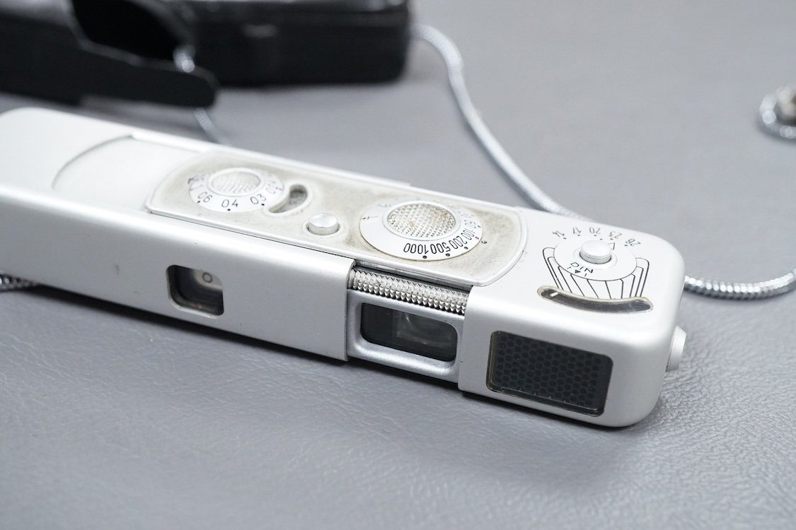 A Minolta Minox miniature camera Model B, in its original leather case with metal lanyard.